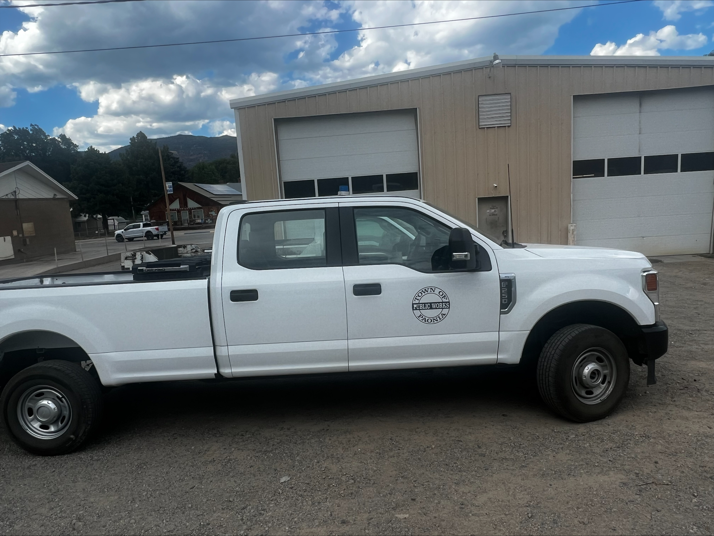 Town of Paonia Public Works (White) Truck Parked in front of Public Works Office Building
